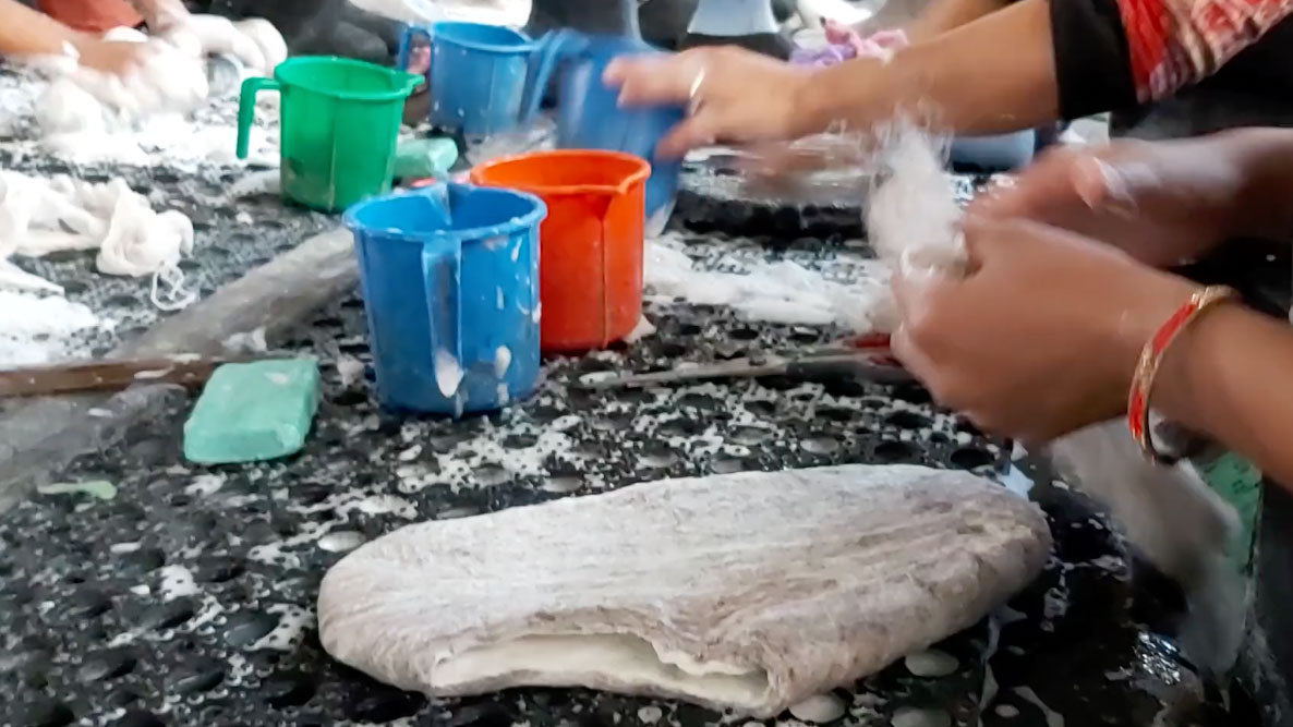 Betterfelt artisans washing and felting the wool before they become felt wool slippers, shoes or boots